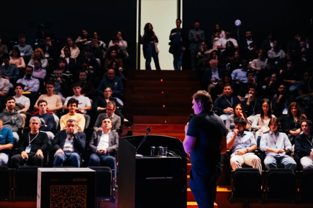 Illia Polosukhin presenting to a full auditorium at Blockchain Confluence 2025